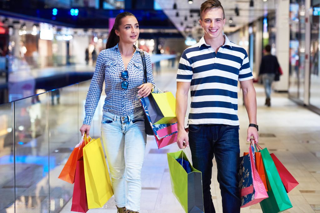 couple shopping online in mall